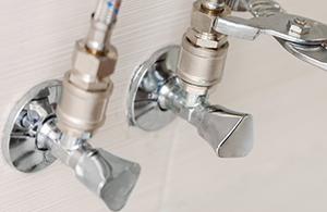 Image of faucets and wrench