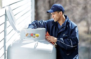petro employee adjusting a propane tank