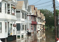 Row of houses with major street flooding