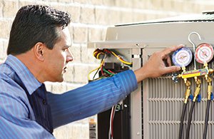 Petro service tech checking AC unit