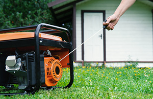 pull starting a generator behind house