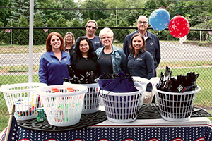 Volunteers in front of donations