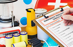 Person checking emergency preparedness list