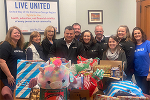 Live United volunteers in front of collected gifts