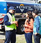 Petro service tech talking to couple
